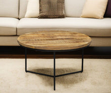 Load image into Gallery viewer, 32" Solid Wood And Iron Round Distressed Cross Legs Coffee Table - Black And Natural