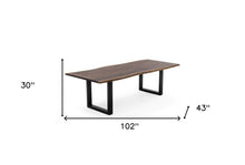 Load image into Gallery viewer, 102" Brown And Black Solid Wood And Metal Sled Base Dining Table
