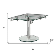 Load image into Gallery viewer, 40" Clear and Silver Glass and Metal Self-Storing Leaf Motion Extendable Dining Table
