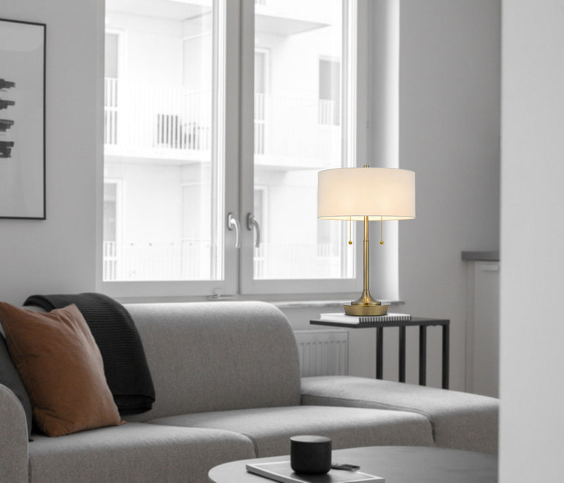 Metal Two Light Candlestick Table Lamp With White Drum Shade - Antiqued Brass