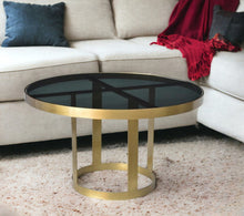 Load image into Gallery viewer, Round Modern Coffee Table - Black And Gold
