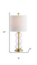 Load image into Gallery viewer, 21" Clear And Gold Table Lamp With Drum Shade
