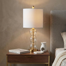 Load image into Gallery viewer, 21" Clear And Gold Table Lamp With Drum Shade
