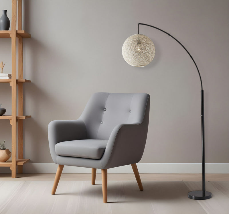 Arched Floor Lamp With Groovy Beige Abstract Wicker Globe Shade - Antiqued Bronze