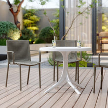 Load image into Gallery viewer, 4 Modern Stackable Plastic Armchair Matched With Round Table
